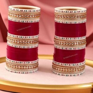 Elevate your bridal ensemble with our exquisite Maroon Punjabi Wedding Bridal Chura Designs, meticulously crafted to embody tradition and elegance.