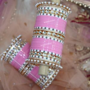 Elevate your bridal look with our exquisite Bridal Pink Chura Set, a perfect blend of tradition and elegance.