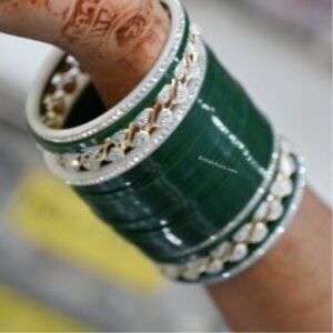 Elevate your accessory game with our exquisite Green Bangles adorned with semi-diamonds.