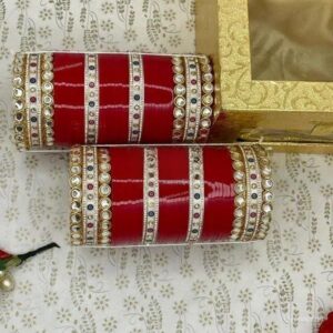 Elevate your bridal look with our exquisite Red Bridal Chura Set, featuring the latest design that perfectly complements your wedding attire.