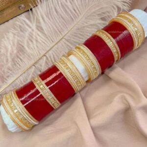 Elevate your traditional attire with our exquisite American Diamond Chura Set in a stunning maroon color.